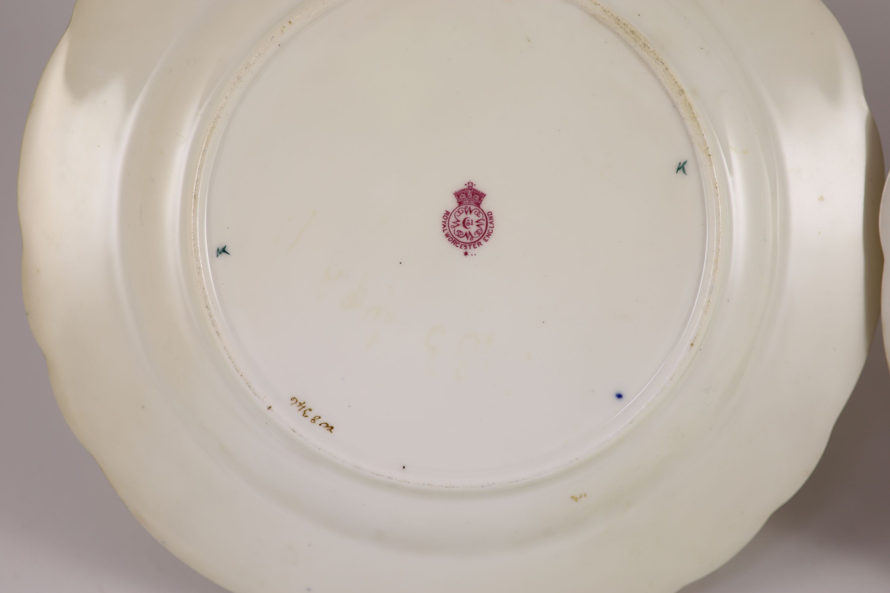 A pair of Royal Worcester fruit painted dessert plates, signed A. Shuck, c.1918, 22.5cm diameter